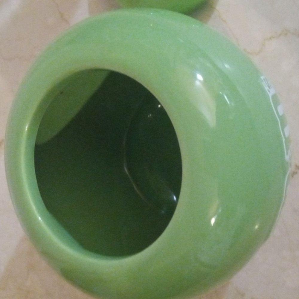 A M&M green canister. It can hold a variety of things. Cookies, Candy, Keys. - Picture 3 of 6